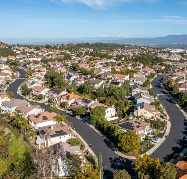 Aliso Viejo neighborhood with hillside homes and clear sky