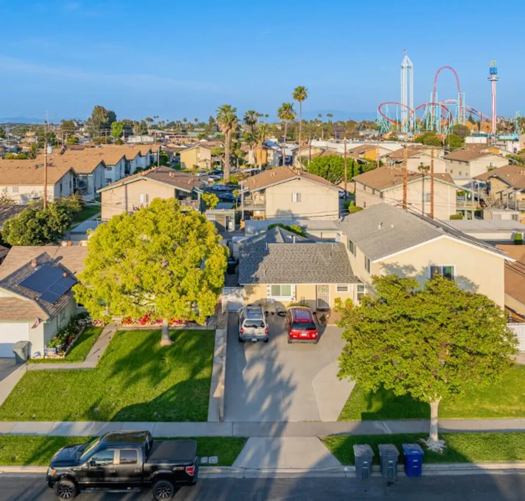Buena Park residential homes with palm trees and clear sky
