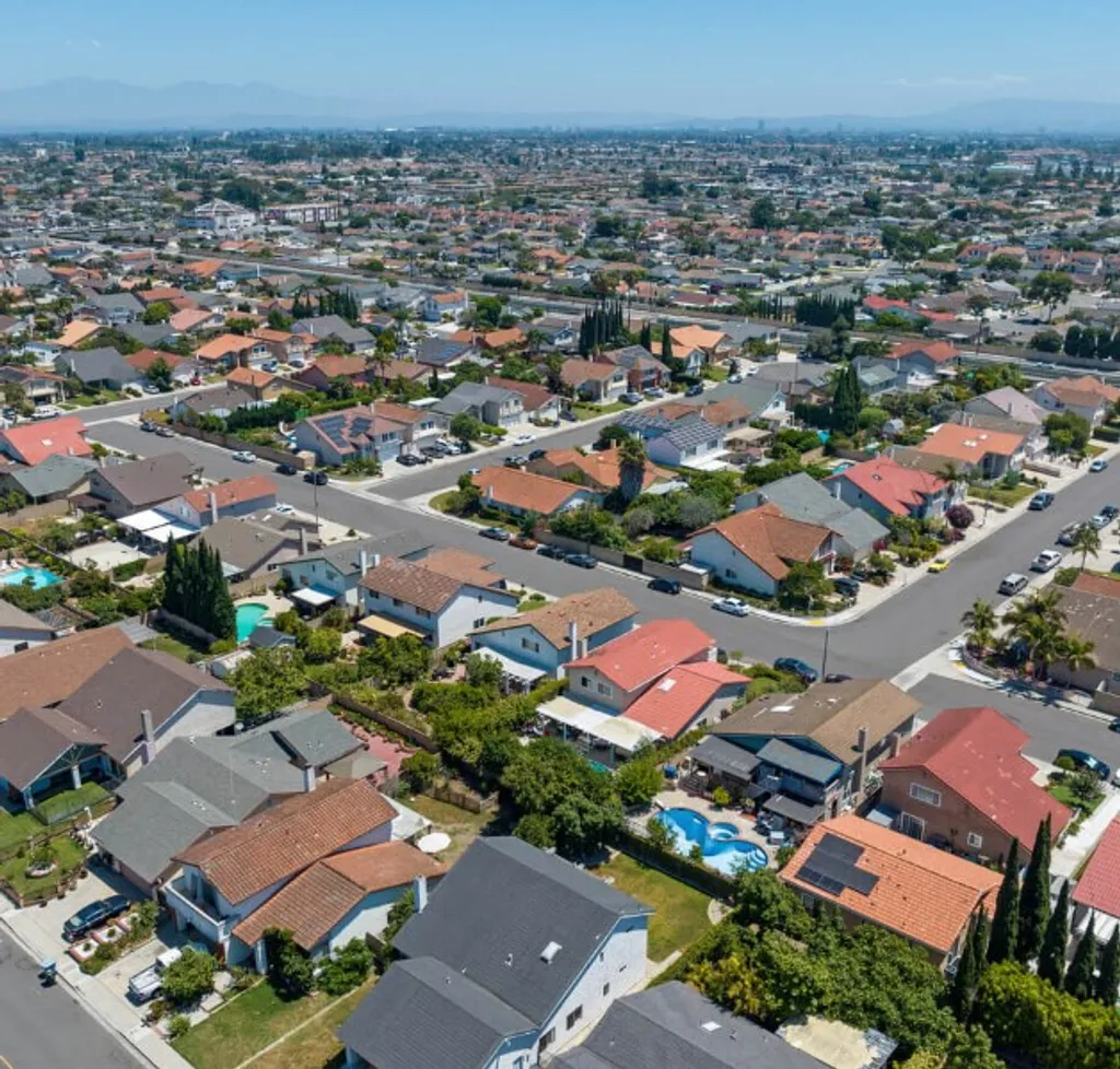 Westminster suburban homes with palm trees and front yards