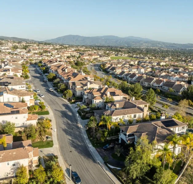 Yorba Linda residential homes with hillside backdrop and mature trees